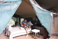 mike playing guitar in our safari tent