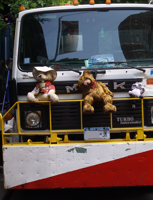 stuffed animals on the grill of a New York City truck, Manhattan, NYC