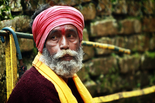 Beggar at stairway of Mahakal Temple