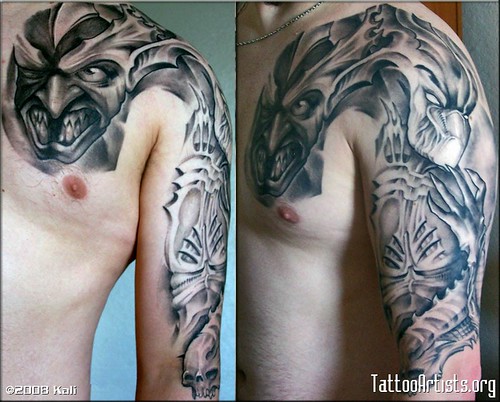 demonic biomechanical tattoo