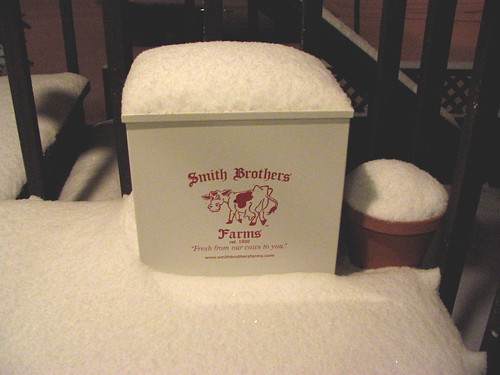Snow from this morning, piled on a milk box.