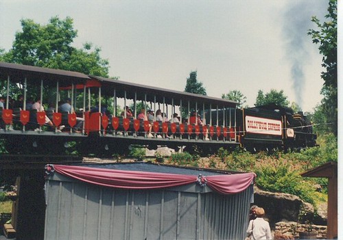 The Dollywood Express passing over a bridge. Dollywood Amusement Park. Pidgeon Forge Tennesee. May 1990. by Eddie from Chicago