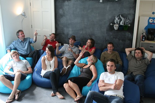 Photo of the Carsonified Team sitting in front of the blackboard