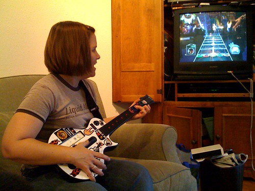 Cathy playing Guitar Hero for the first time
