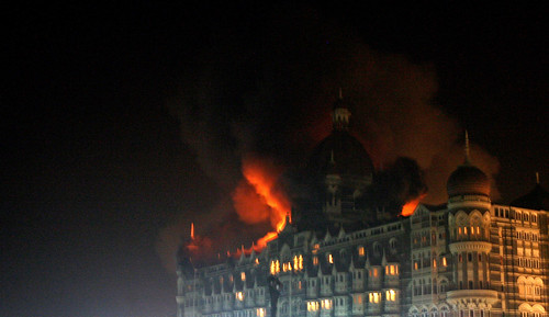 A fire breaks out of the dome of the Taj hotel in Mumbai