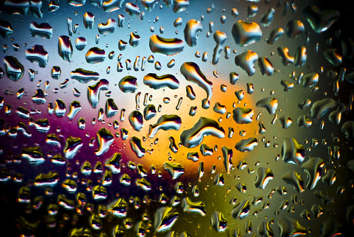 light rain shower on bus shelter window