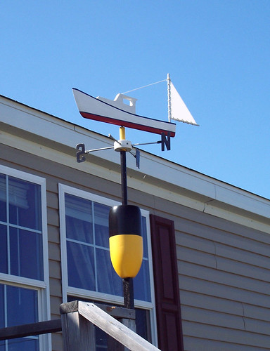 Beal's Island, Maine FH060007. Wind vane personalized with a lobster buoy whose colors and pattern are legal identification.