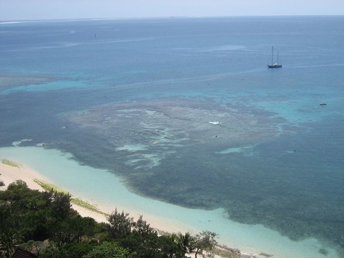 Phare Amadee:  Sabbatical III at anchor behind the reef at Amadee