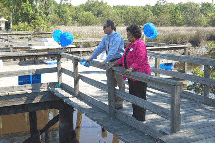 Ricky Sweat, Area Director in Baxley Georgia, talks to Georgia State Director Shirley Sherrod at the Georgia Earth Day celebration in Riceboro. The project announced by USDA will remove will remove contaminants from local rivers and streams. 