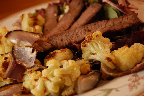 steak salad with roasted onions and cauliflower