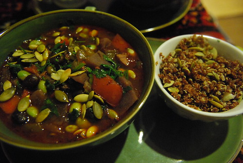 Vegetable soup with red quinoa and pumpkin seeds