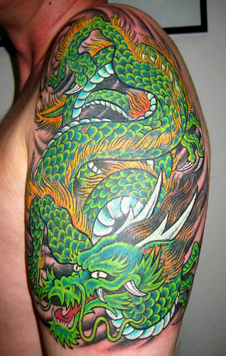dragon tattoo color. dragon coverup tattoo