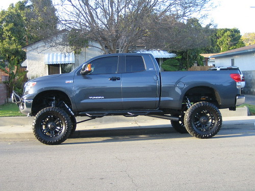 Lifted Toyota Tundra Crewmax For Sale. Custom lifted Tundra next to
