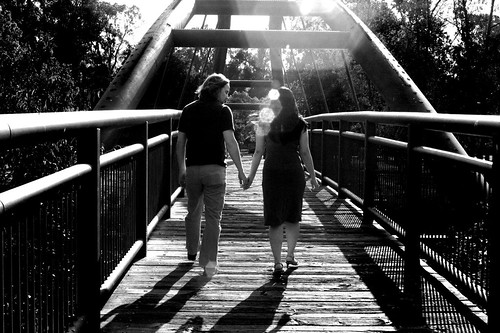 black and white pictures of people holding hands. holding hands on bridge - lack