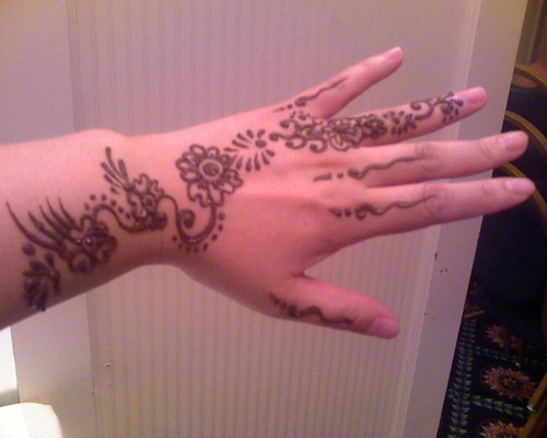 Creative Henna tattoo on hand