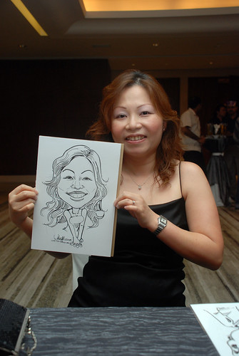 Caricature live sketching for Ezra Holdings 1