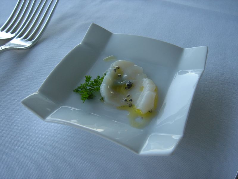 Scallop sashimi with lava salt and lemonade oil