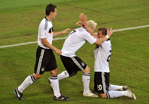 Bastian Schweinsteiger celebrates with Miroslav Klose and Lukas Podolski after scoring