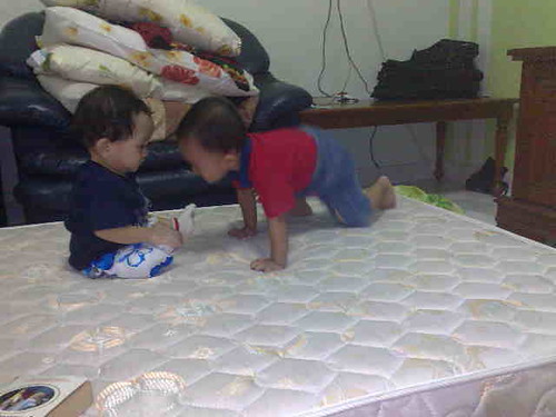 Hafiy playing with Nazhan during their visit.