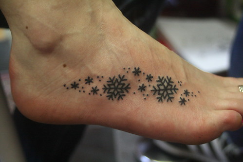 snowflake tattoo designs. star and snowflake tattoos