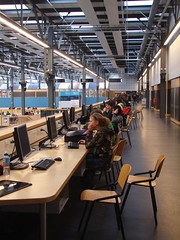 students working together and using computers in the big hall of the Industrial Design building by The Shifted Librarian