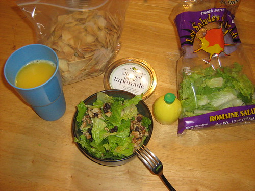 Salad, pita chips, and tapenade