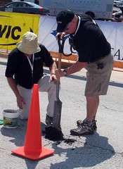 Tour of Missouri crew fixes a pothole