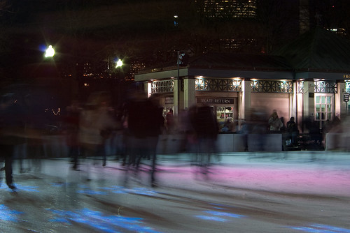 Night time ice skaters