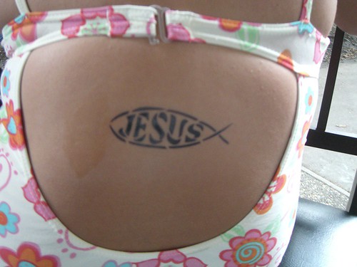 Jesus tattoo on the body of a beautiful woman