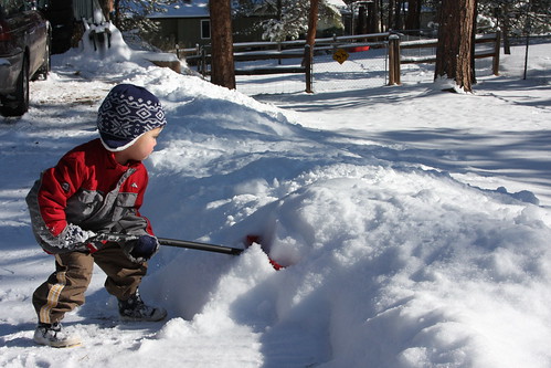 Austin shoveling snow.