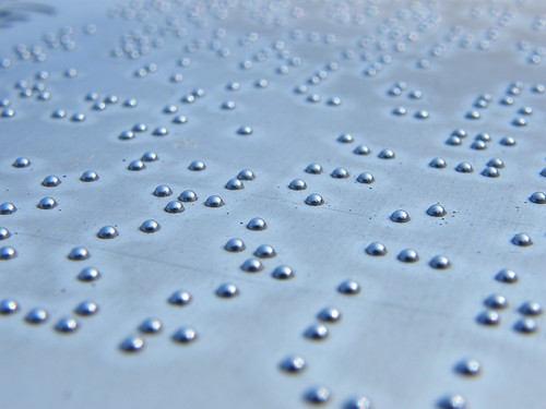 A metal plate covered in braille