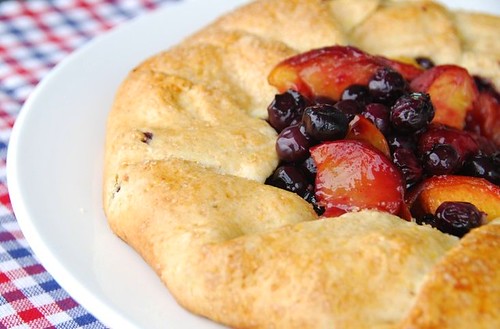 blueberry peach galette on checkered mat