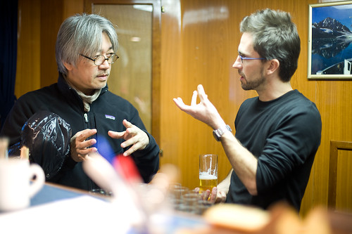 Ryuichi Sakamoto with Sam Collins discussing how climate change affects the Arctic