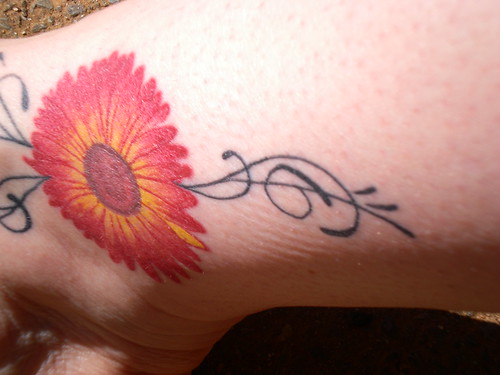 Gerberah daisy foot tattoo