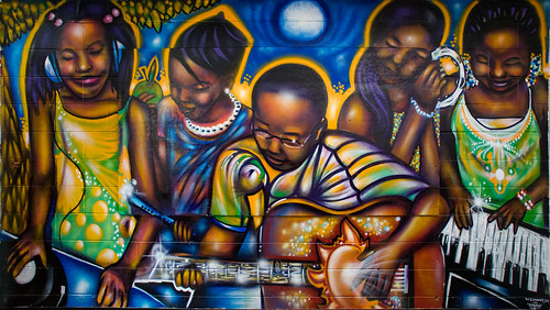 mural of African-American boys and girls playing instruments with joy!