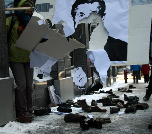 Protesters Throwing Shoes at Bush posters in Montreal by Anirudh Koul.