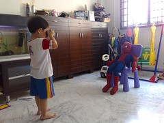 Isaac takes a photo of Spider Man