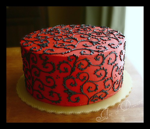 Red Cake with Black Scrolls
