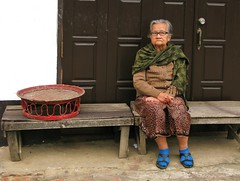 I was taking a photo of the red tray and she just sat down - Luang Prabang, Laos