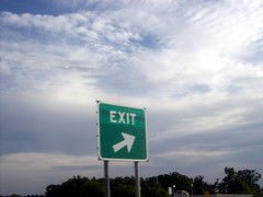 clouds and exit sign