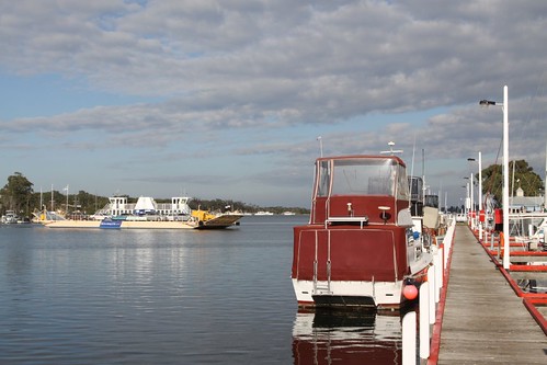 Raymond Island Ferry passing moored boats at Paynesville