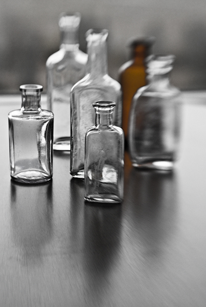 old bottles seen with a lensbaby