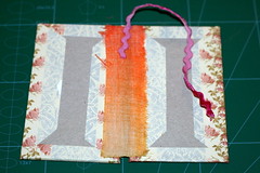 Attaching the ribbon to the spine as a bookmark