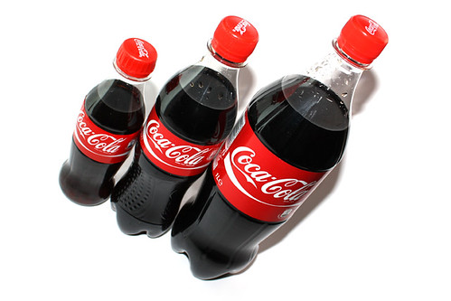 This is a picture of 0,25l , 0,5l and 1l Coca Cola bottles next to each 