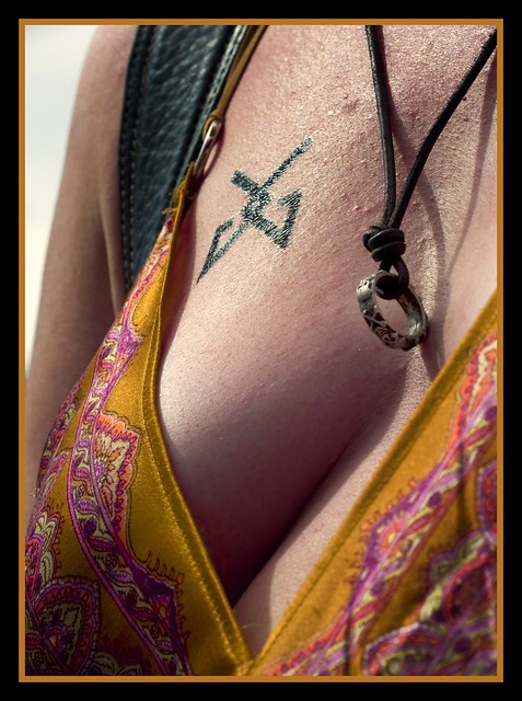 A woman at a gay pride rally in SC. The tattoo is a lesbian symbol.