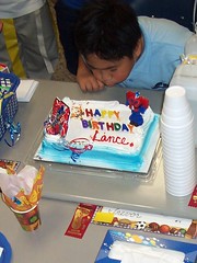 Lance blows out his candles at school