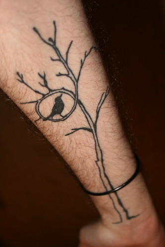 Healed #39;bird in a tree#39; tattoo