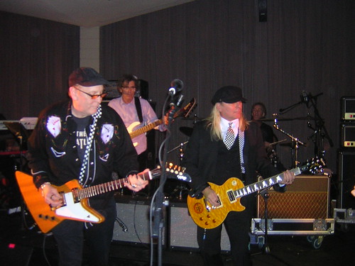     Rick Nielsen and Robin Zander perform at a post-show jam. The guitar Nielsen is playing fetched $4,000 in an auction. 