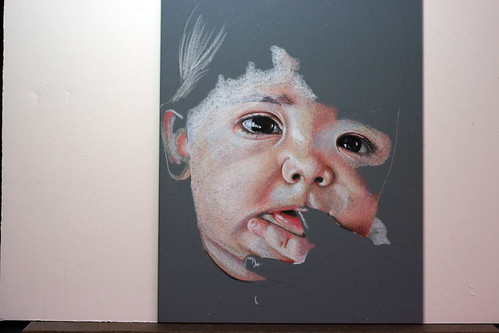 In progress photo of colored pencil drawing entitled Emre at 7 Months