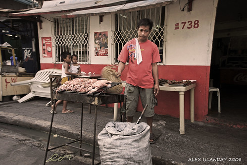 street vendor cooking barbeque for sale in the street of Manila Philippines Buhay Pinoy  Ngayon Filipino Pilipino  people pictures photos life Philippinen